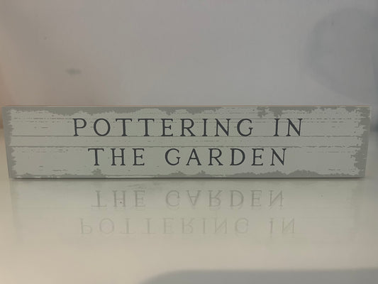 Wooden Plaque - Pottering in the garden